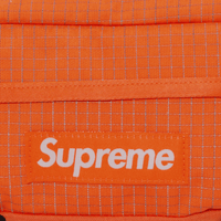 SUPREME RINONERA NARANJA REFLECTIVA