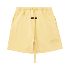 FEAR OF GOD ESSENTIALS SHORT DE ALGODON AMARILLO TULCAN