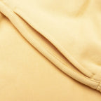 FEAR OF GOD ESSENTIALS SHORT DE ALGODON AMARILLO TULCAN
