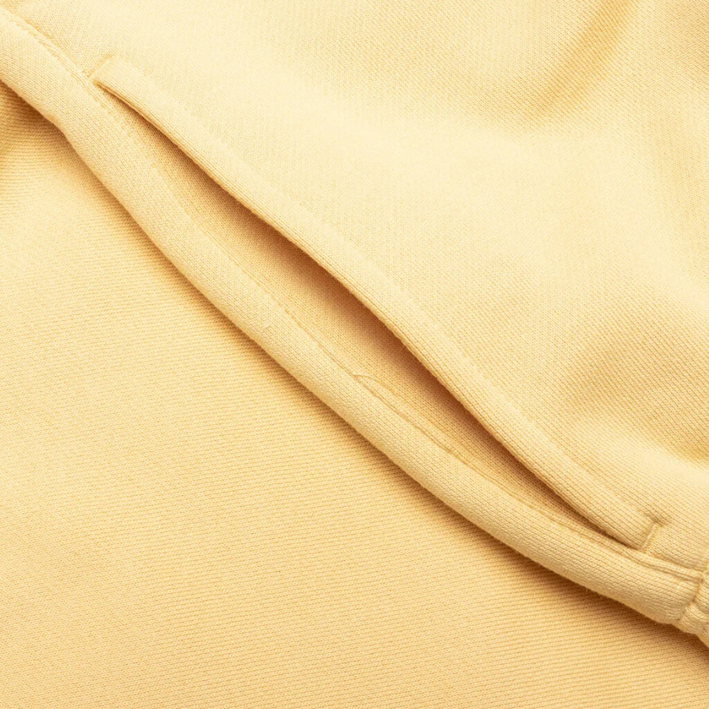 FEAR OF GOD ESSENTIALS SHORT DE ALGODON AMARILLO TULCAN
