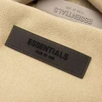 FEAR OF GOD ESSENTIALS BUZO OVERSIZE BEIGE ARENA