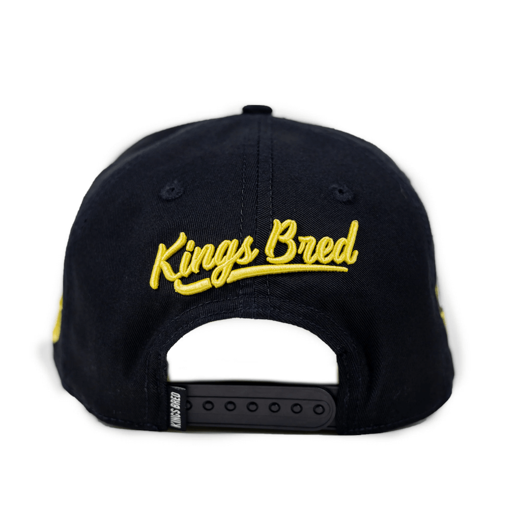 KINGS BRED X RIMAS SPORTS TATIS JR 23 GORRA AJUSTABLE NEGRA / CAFE
