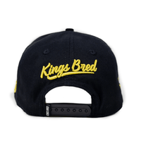 KINGS BRED X RIMAS SPORTS TATIS JR 23 GORRA AJUSTABLE NEGRA / CAFE
